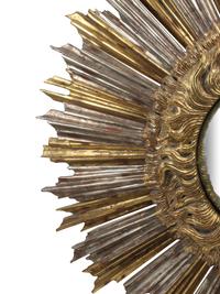 An Oversized Silvered and Giltwood Sunburst Mirror