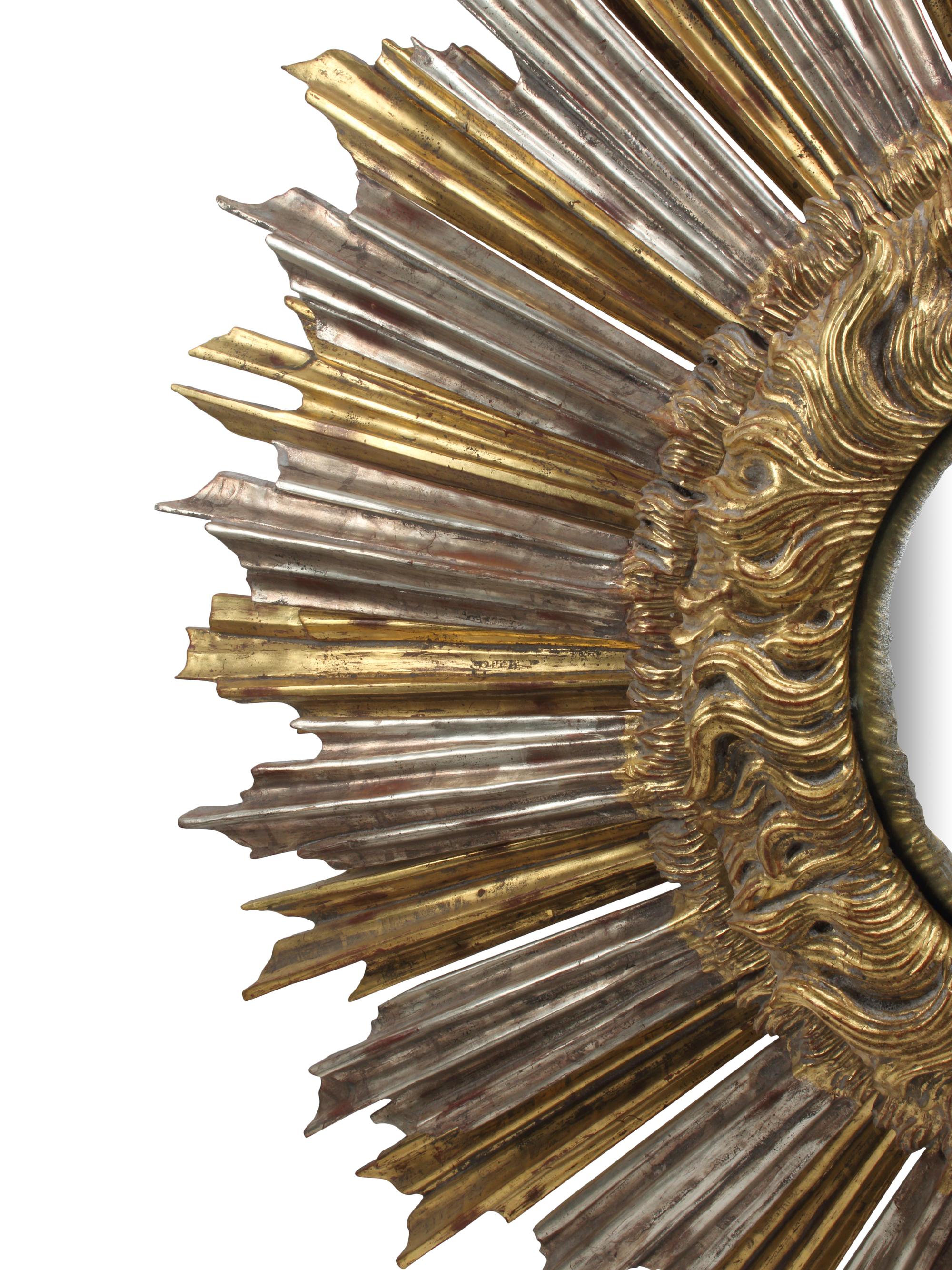 An Oversized Silvered and Giltwood Sunburst Mirror