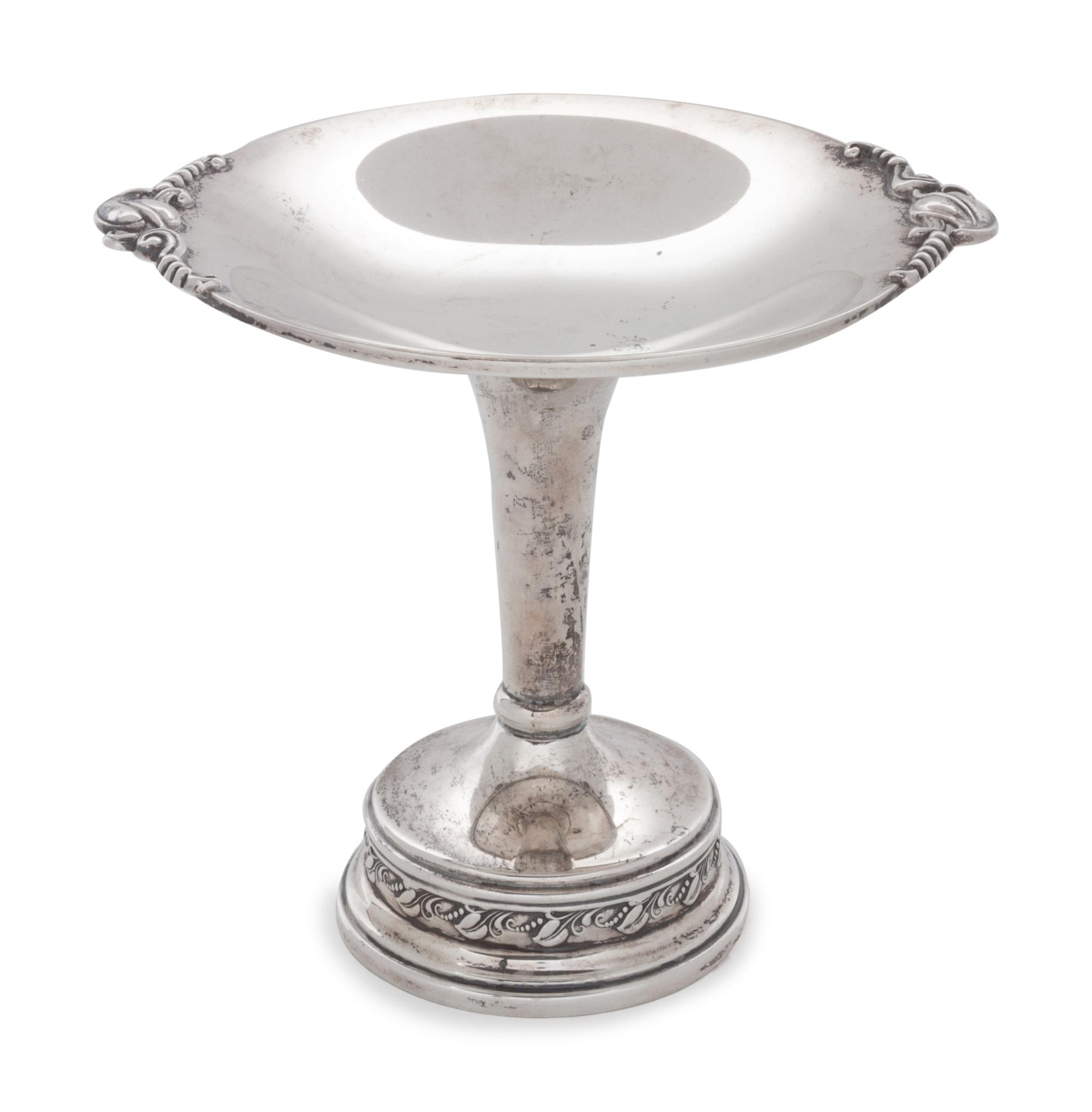 of typical form with foliate cast handles.