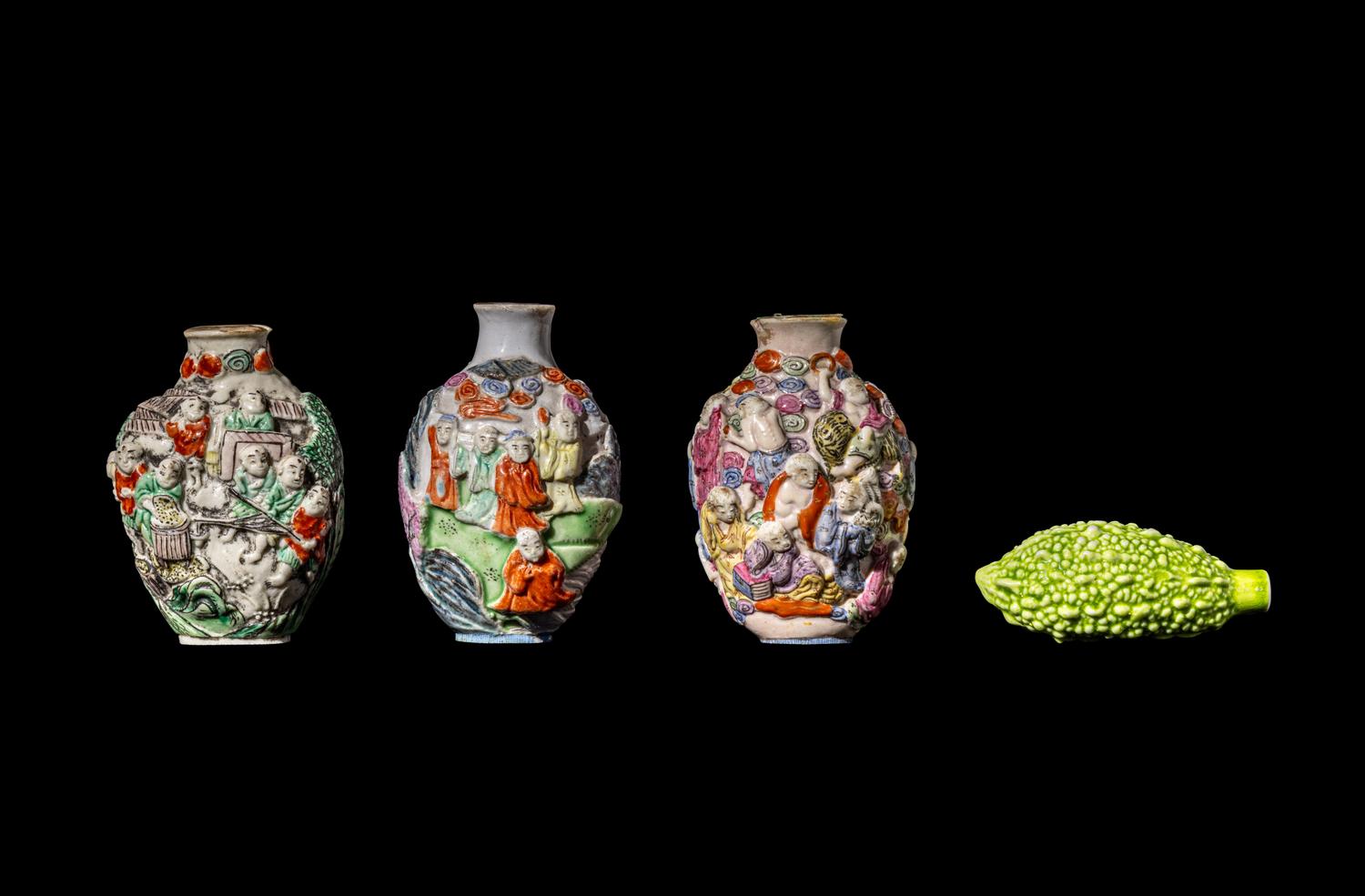 Four Chinese Famille Rose Molded Porcelain Snuff Bottles