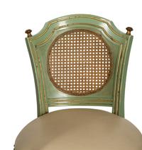 Four Louis XVI Style Painted, Parcel Gilt and Cane Back Bar Stools