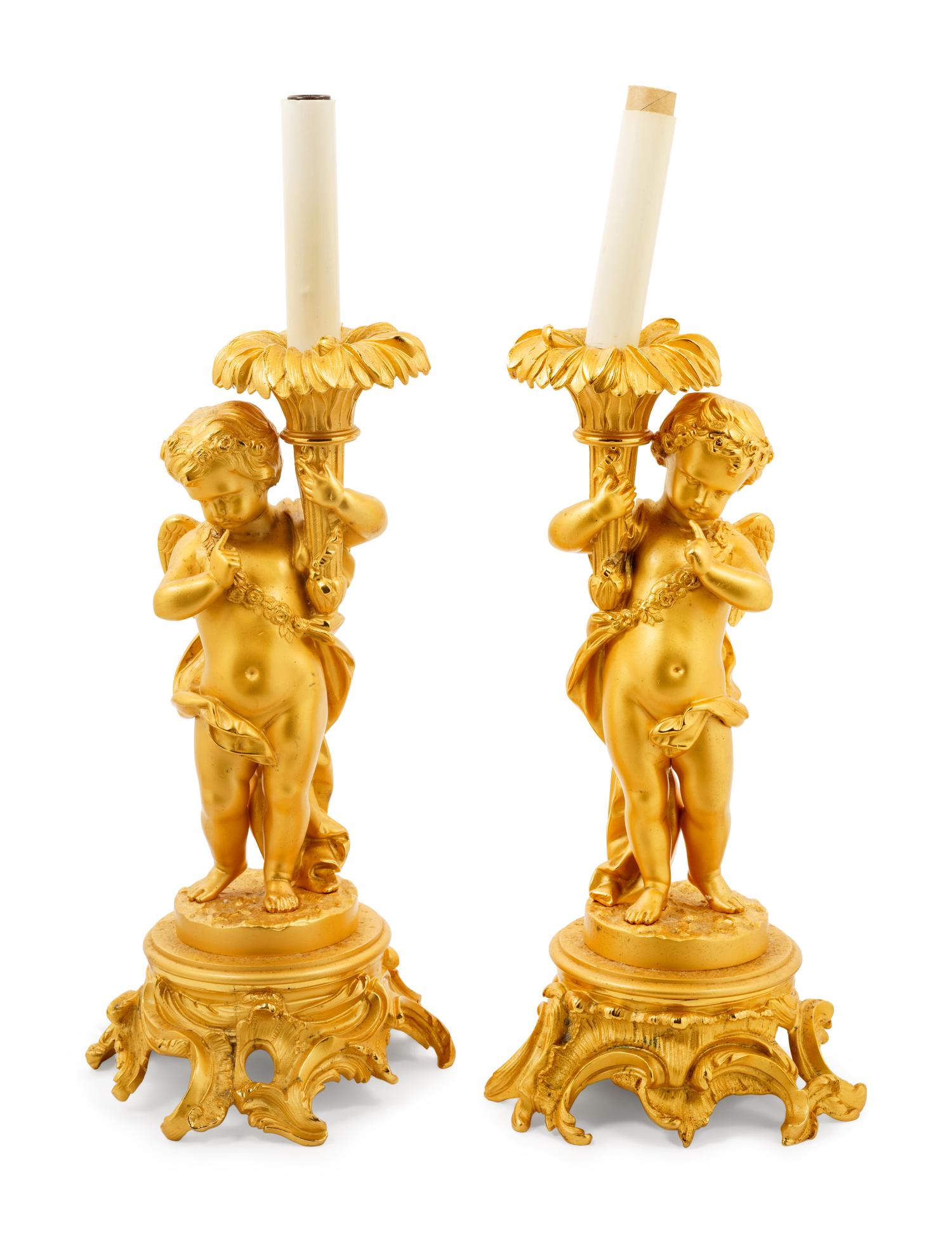 A Pair of Louis XV Style Gilt Bronze Putto Lamps