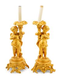 A Pair of Louis XV Style Gilt Bronze Putto Lamps