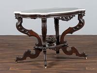 A Renaissance Revival Carved Walnut Marble Top Center Table