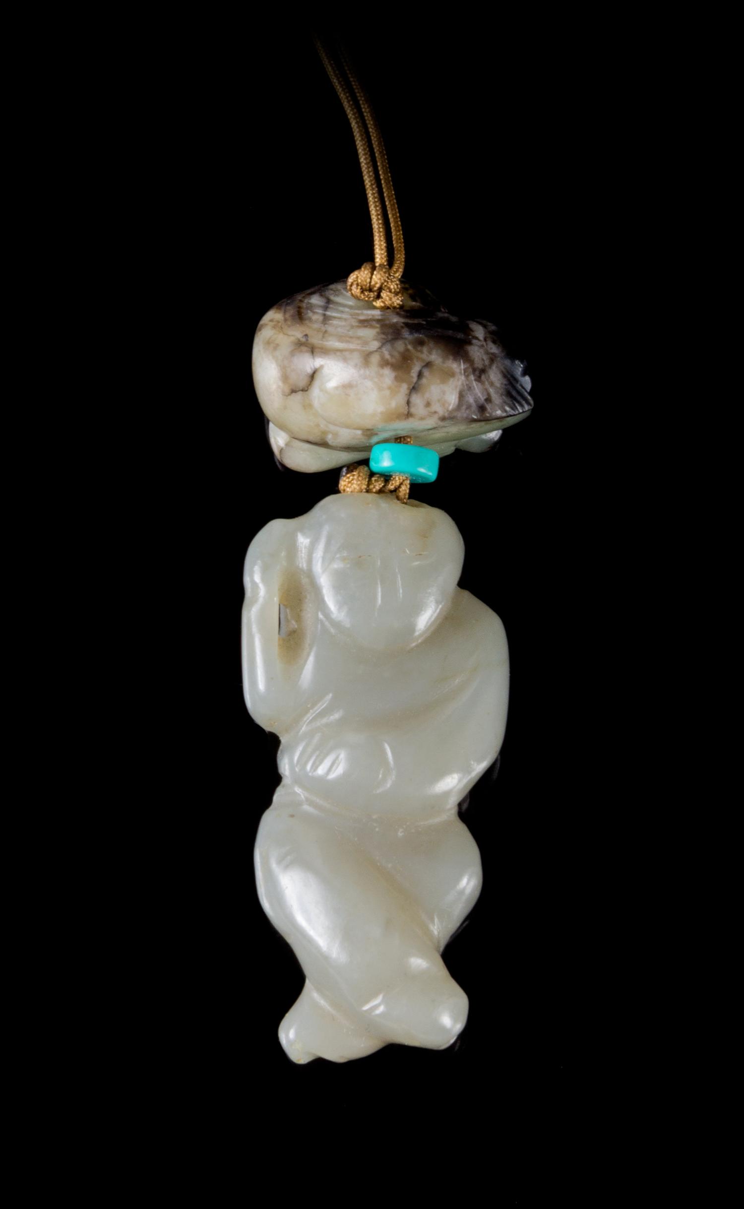 Two Jade Pendants Length of larger 2 inches.