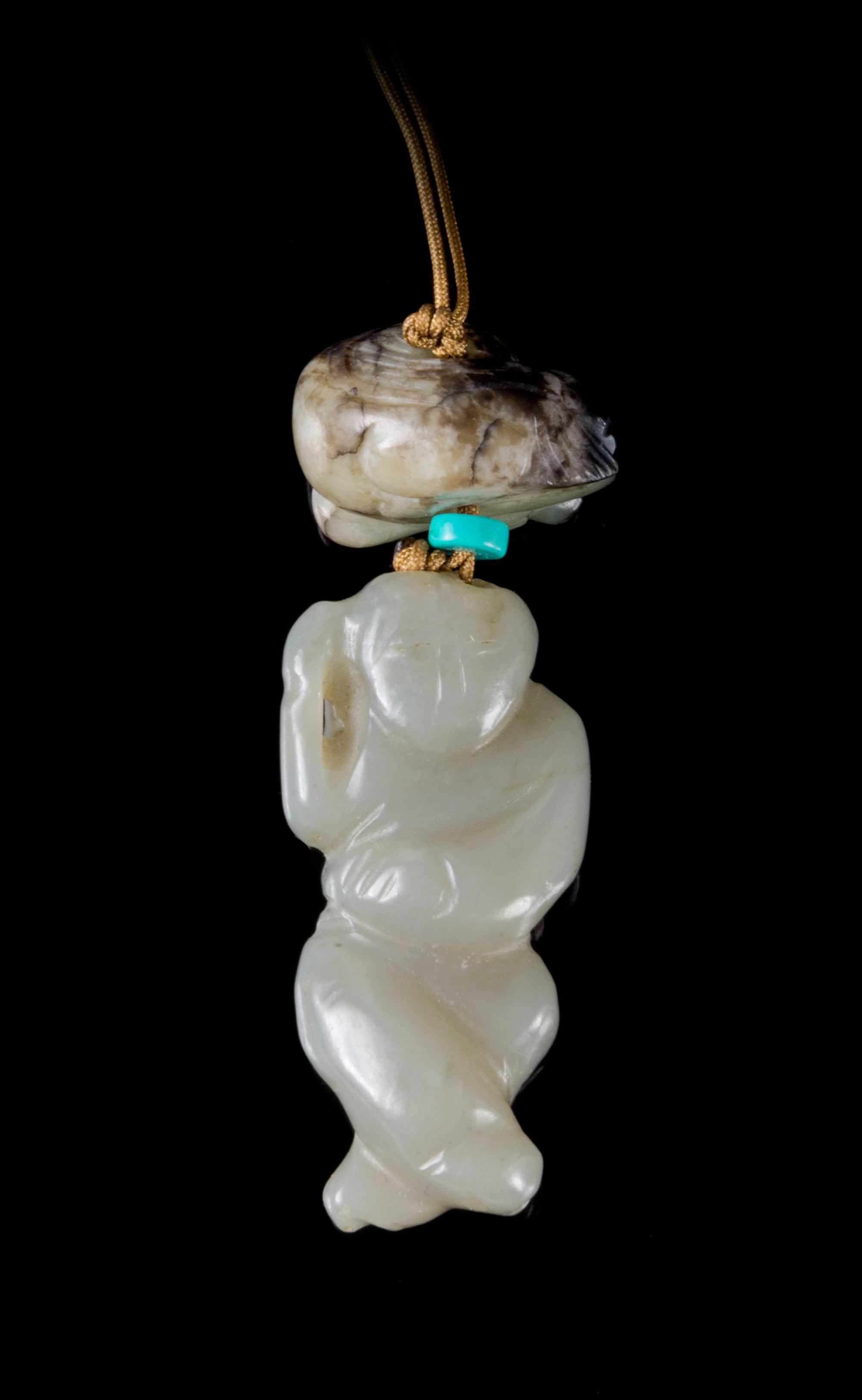 Two Jade Pendants Length of larger 2 inches.