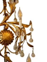 A Pair of Italian Gilt Tole Seven-Light Sconces