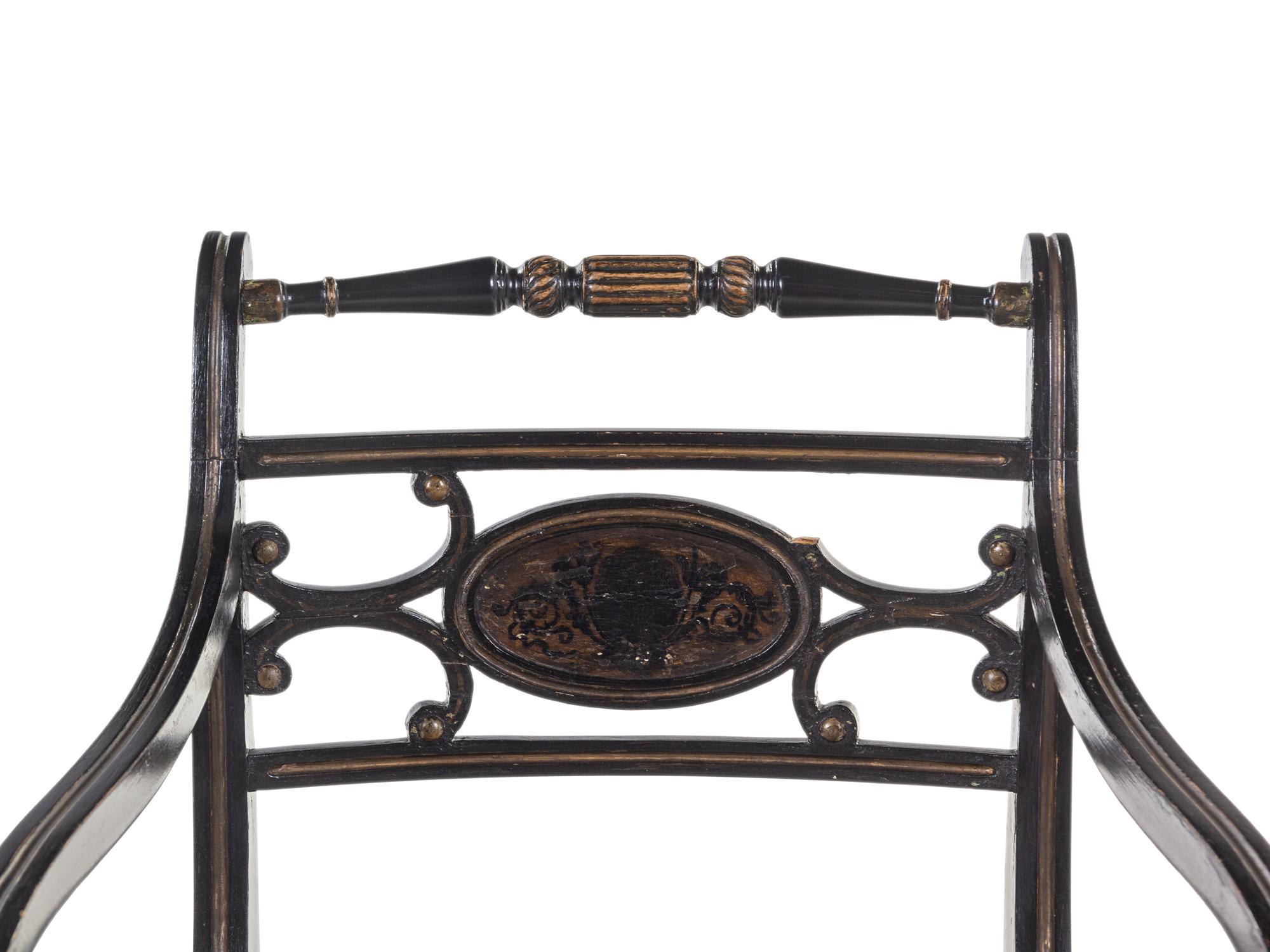A Regency Painted and Parcel-Gilt Cane Seat Armchair