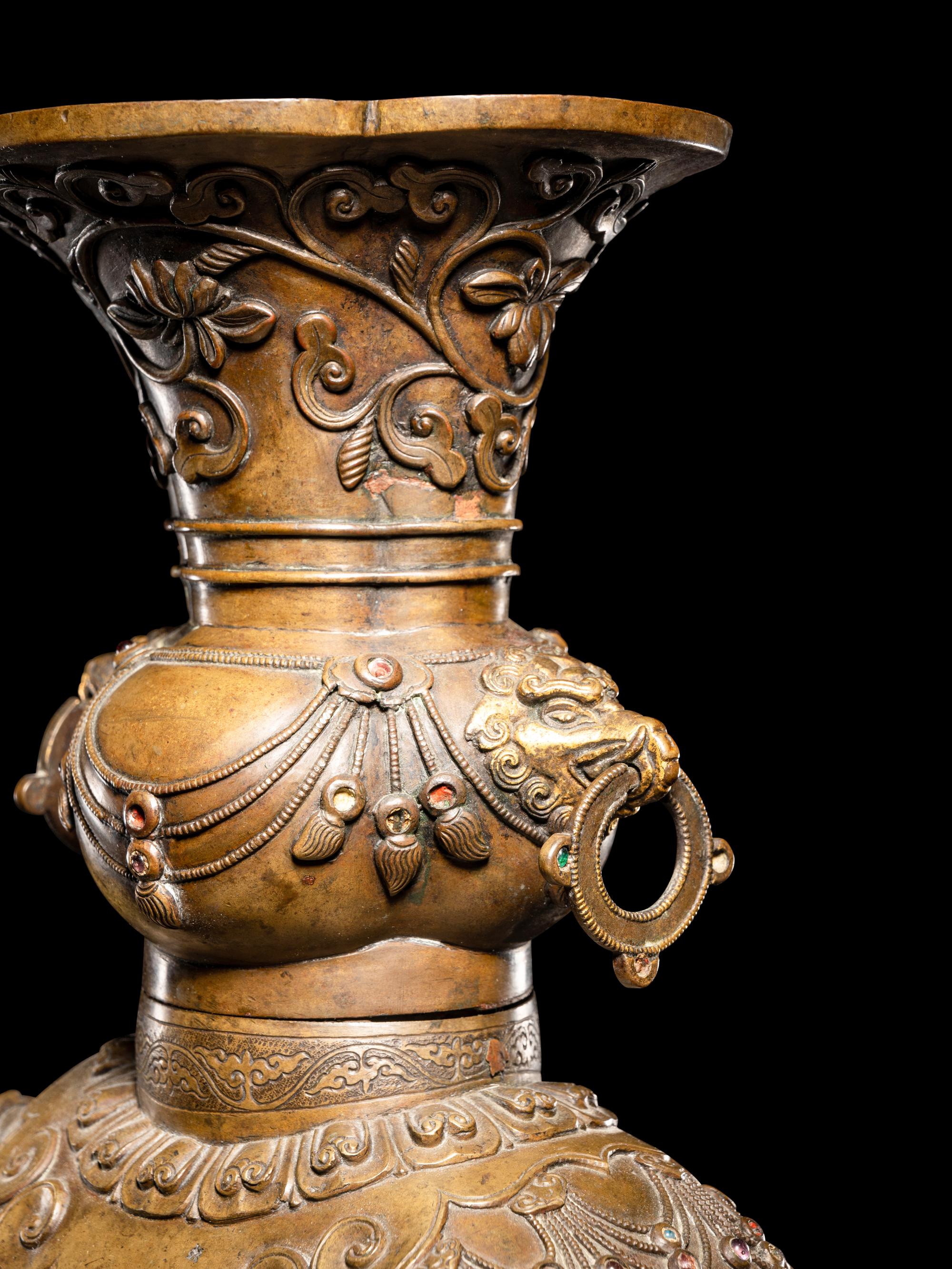 An Embellished Bronze Figure of an Elephant and Vase