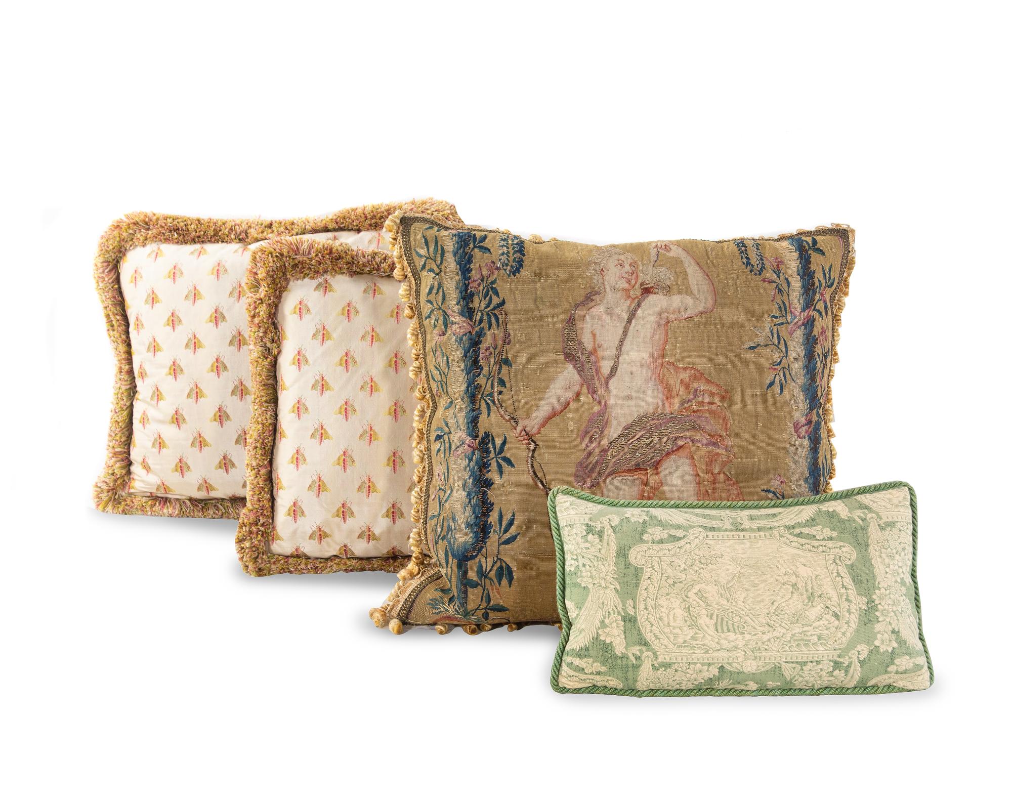 A Continental Tapestry Pillow and Three Modern Pillows