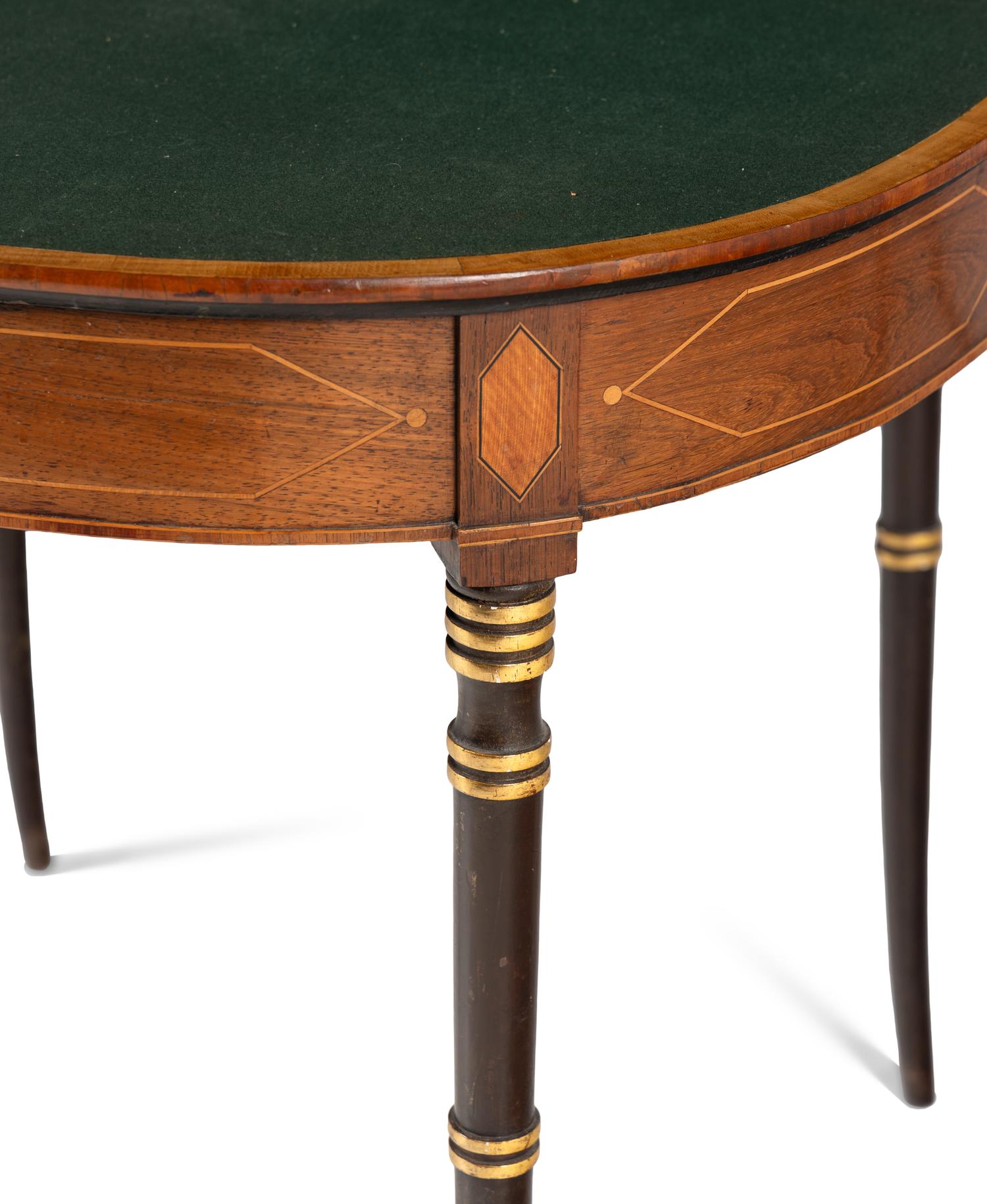 A Regency Parcel Gilt Mahogany Game Table