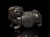 A Chinese carved mottled dark brown soapstone Buddhist lion, 18th century or earlier 壽山石獅子 十八世紀或更早