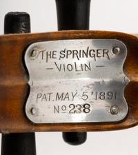 An Aluminum and Tiger Maple Violin and Bow