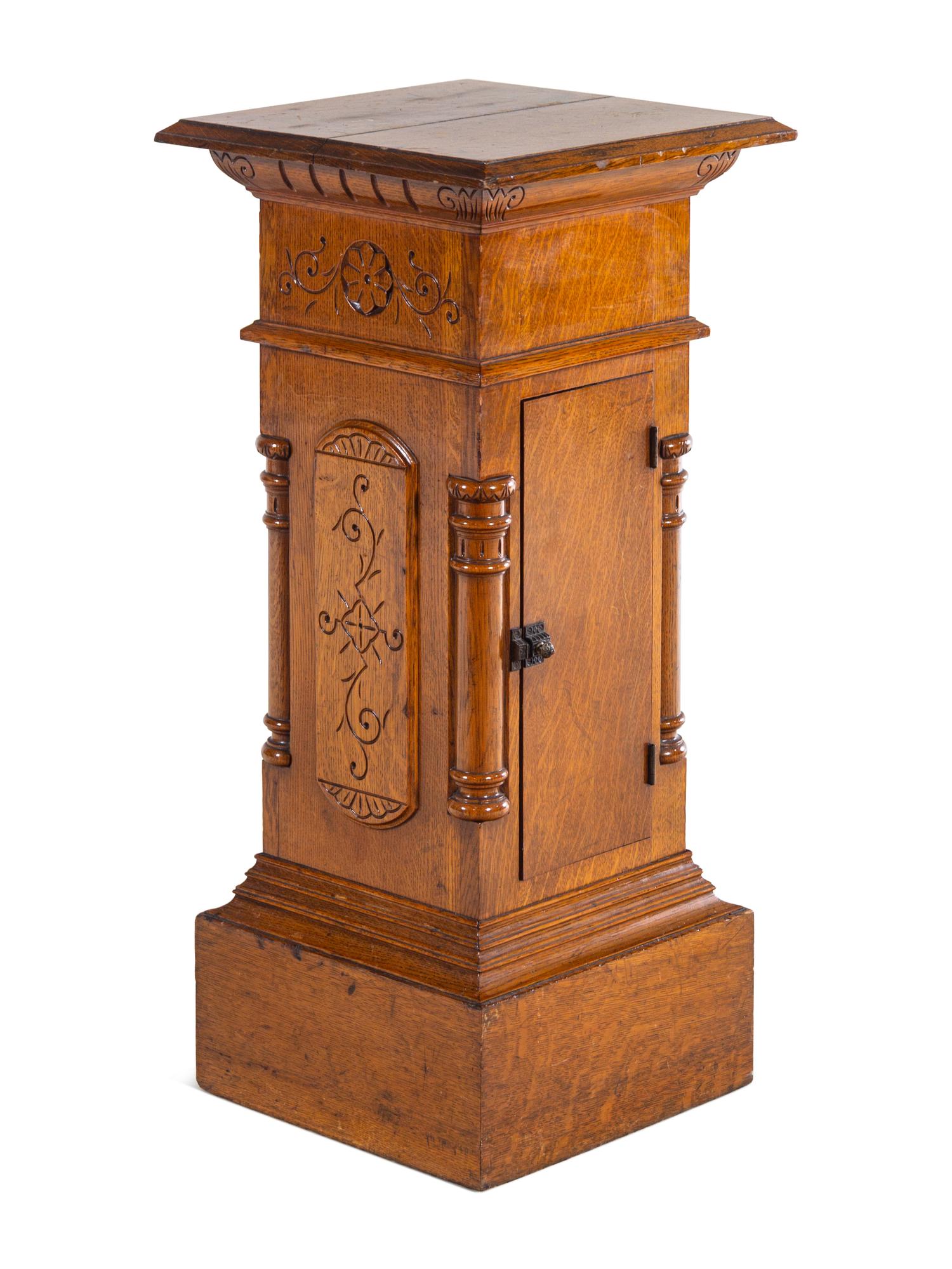 An Aesthetic Movement Carved Oak Pedestal
