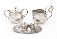 A Group of Mexican Silver Table Articles, , comprising a creamer and sugar, two spoons, two castors in the shape of gourds and a small