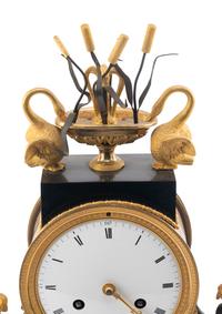 An Empire Ormolu, Black Granite and Patinated Bronze Mantel Clock