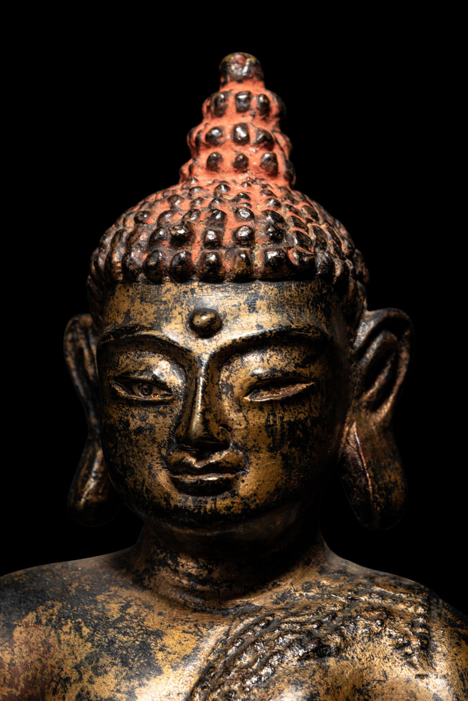 A Large Nepalese Gilt Bronze Figure of Seated Buddha