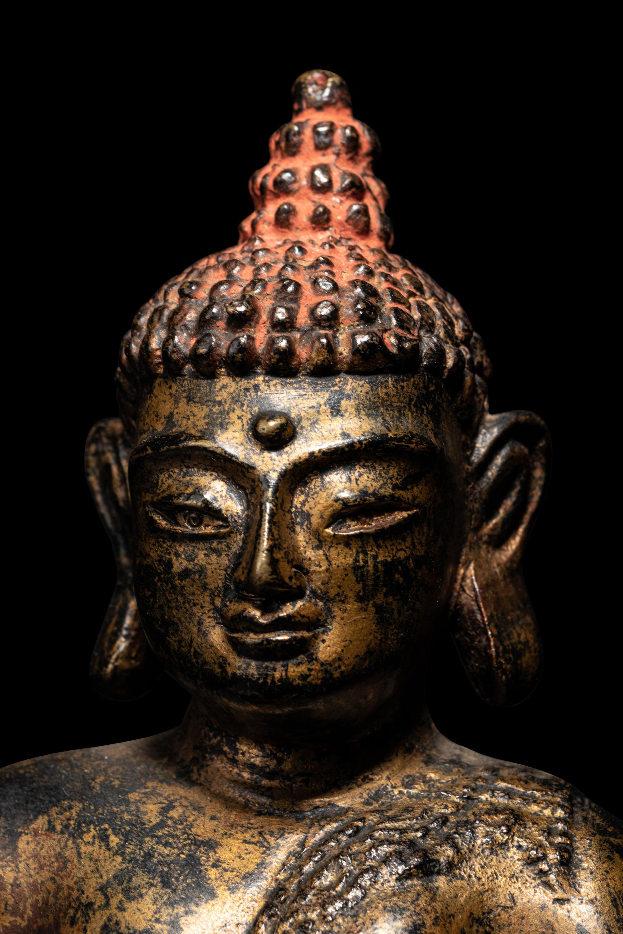 A Large Nepalese Gilt Bronze Figure of Seated Buddha