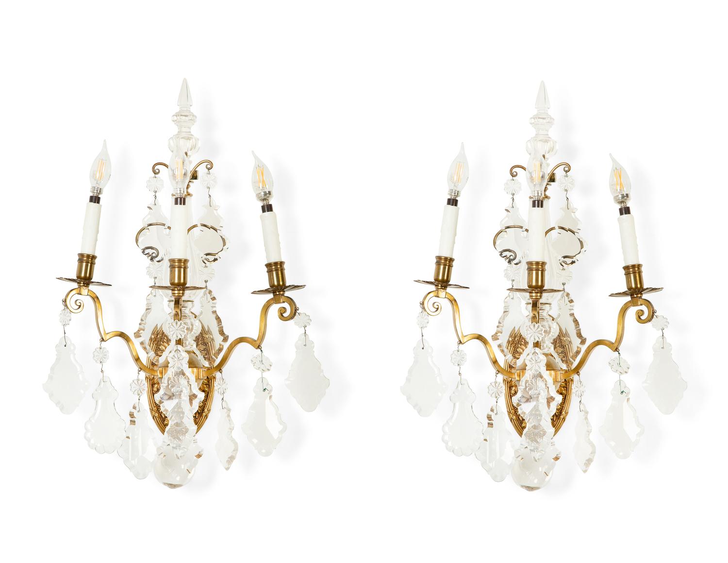 A Pair of Louis XV Style Gilt Bronze and Cut Glass Three-Light Sconces