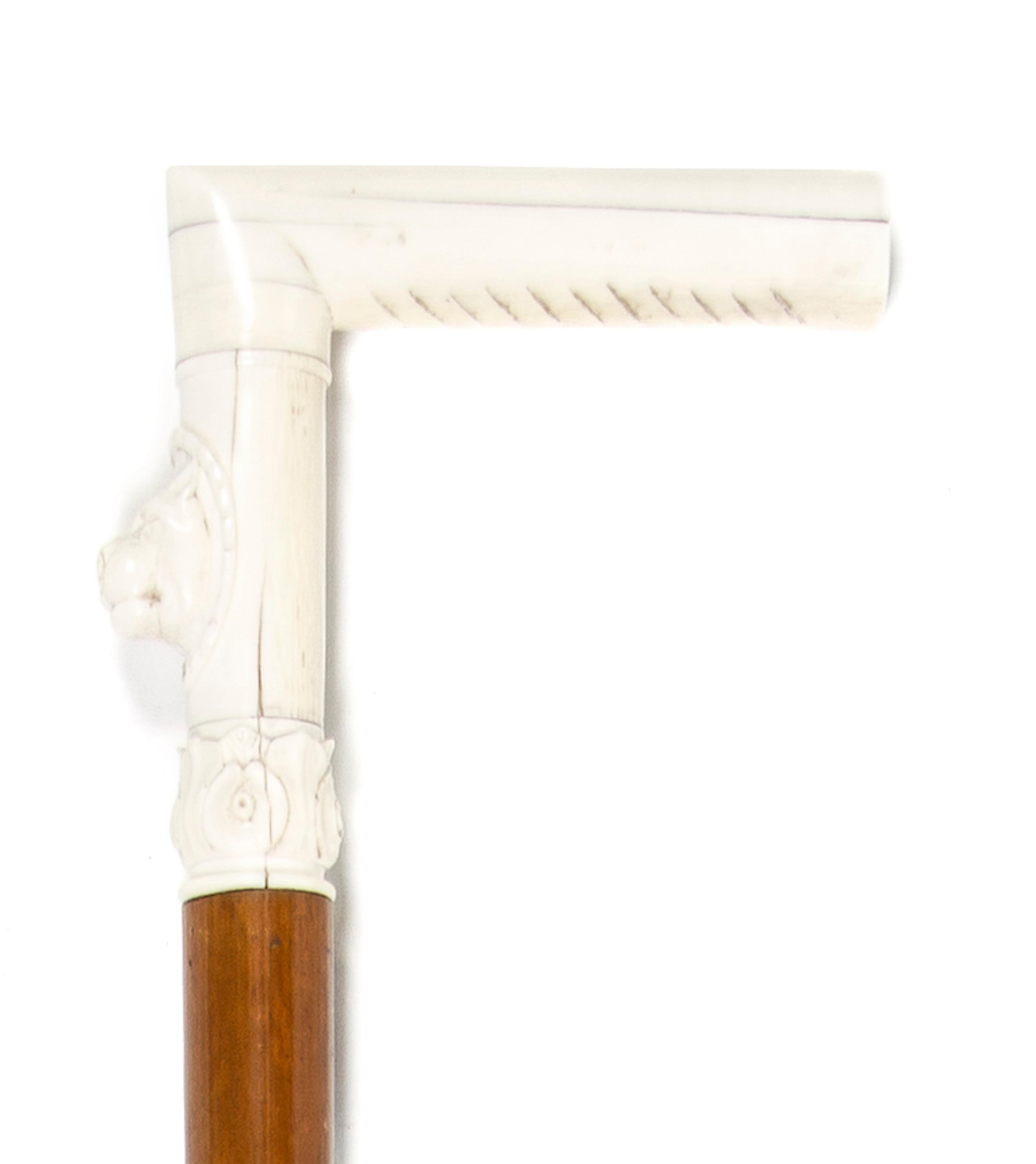 A Continental Carved Ivory Cane Handle, Height overall 35 1/2 x width of handle 4 1/4 inches.