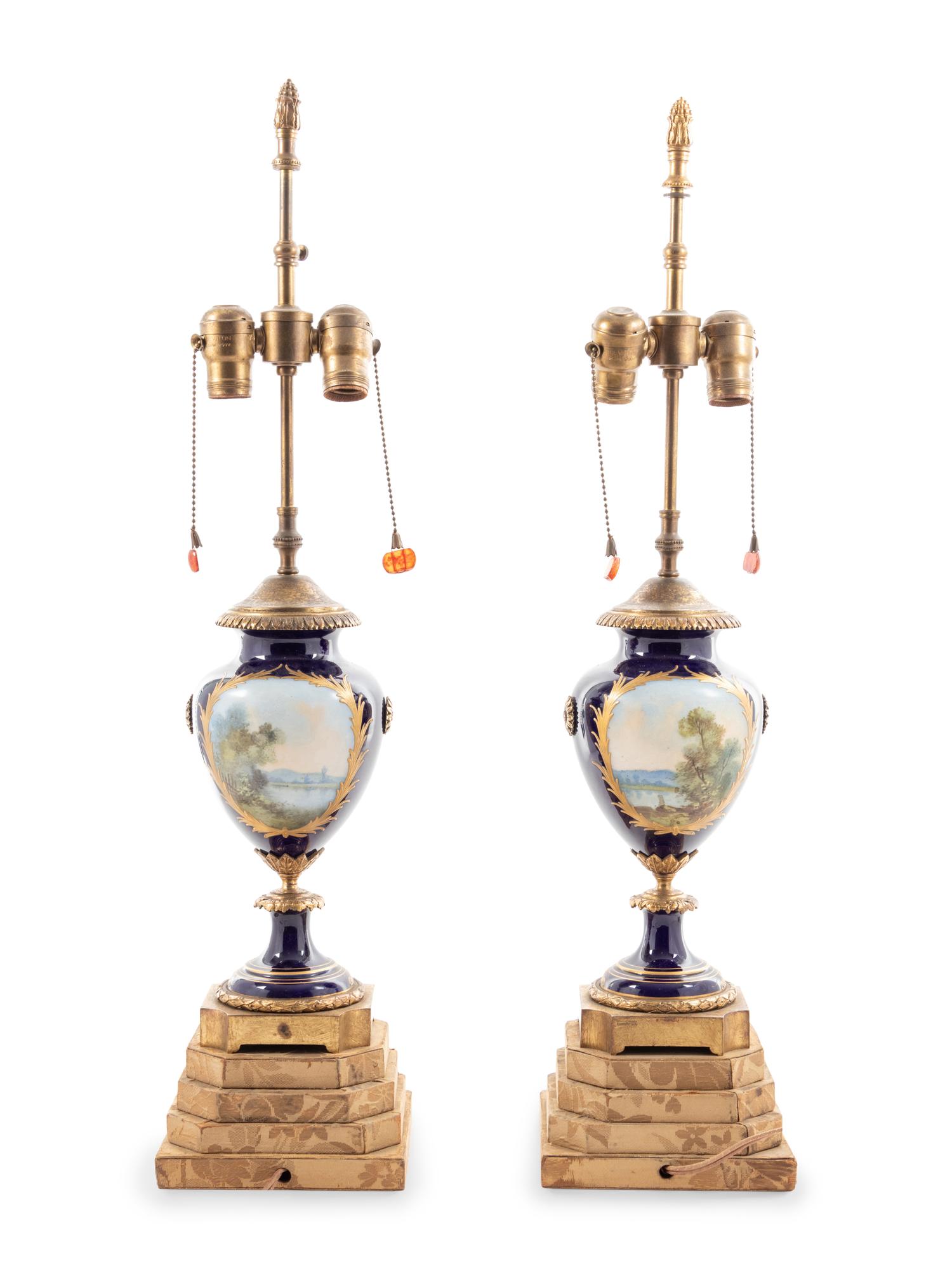 A Pair of Sèvres Style Porcelain Urns Mounted as Lamps