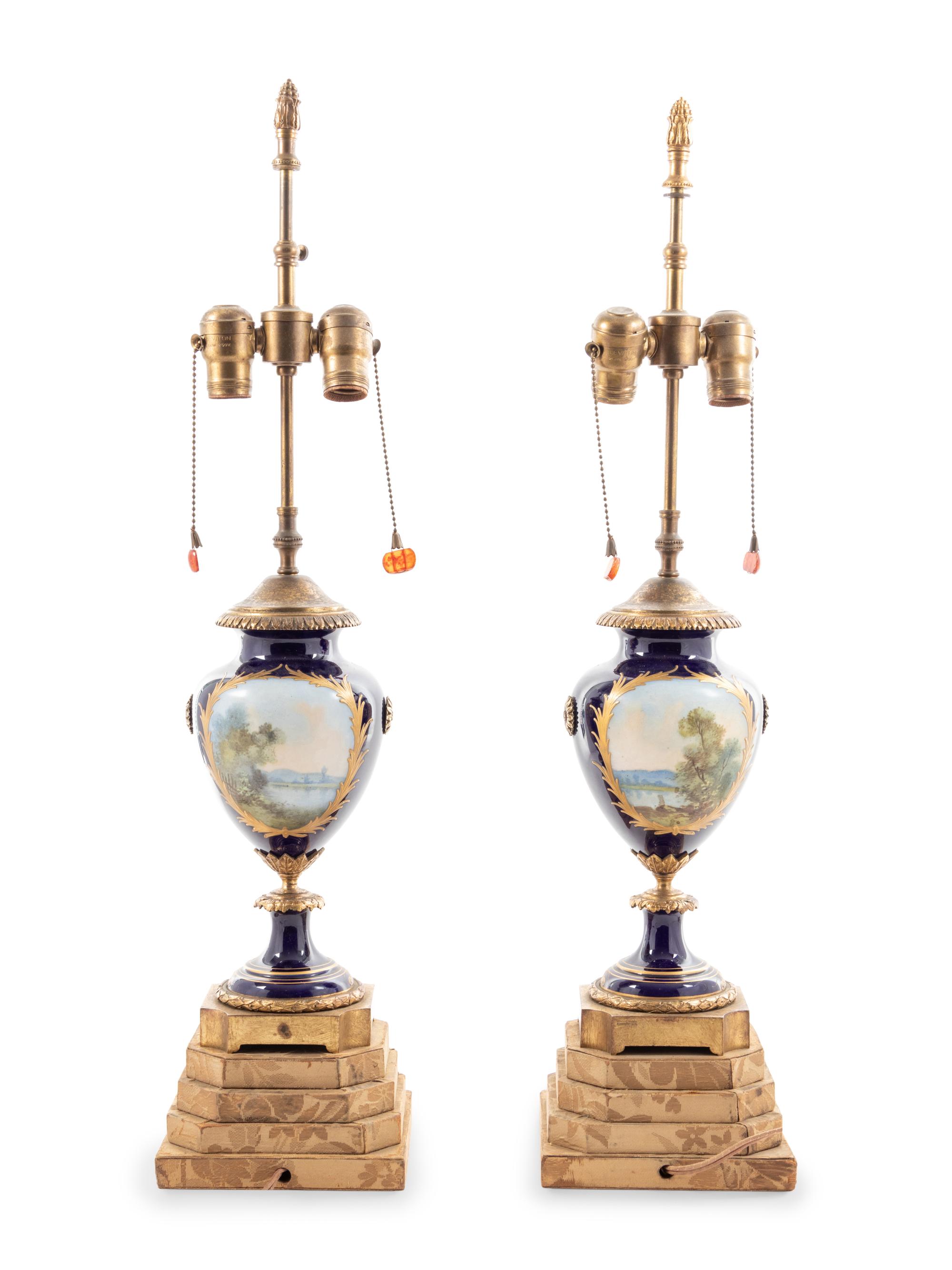 A Pair of Sèvres Style Porcelain Urns Mounted as Lamps