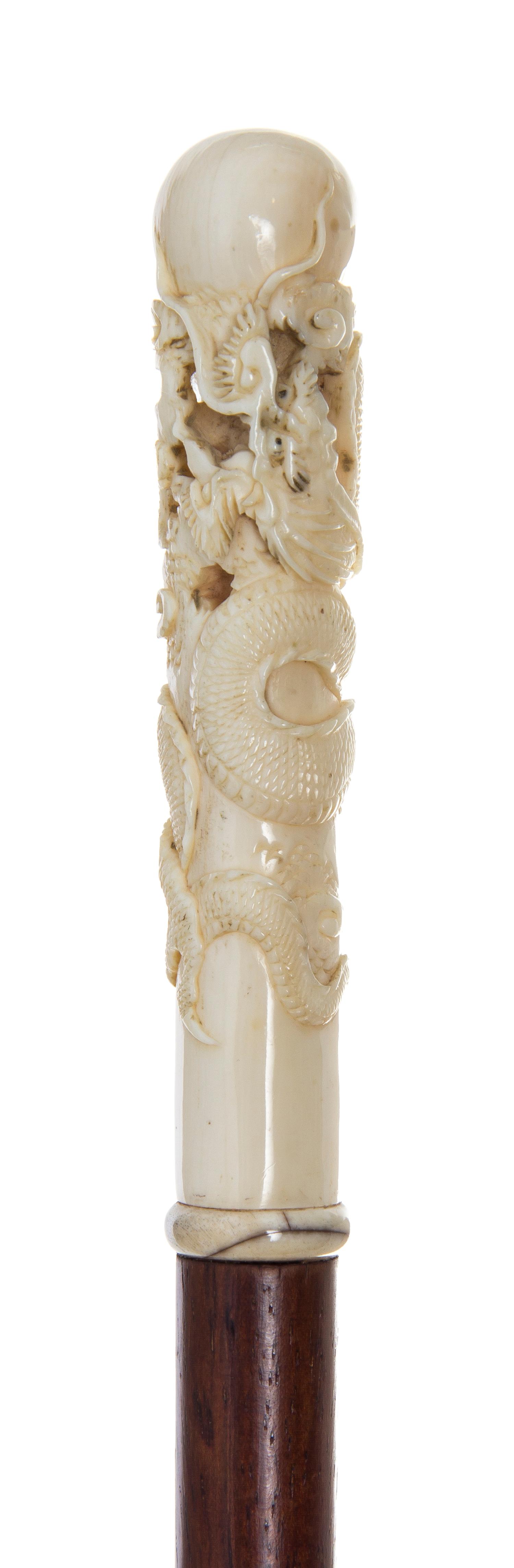 A Chinese Ivory Handled Walking Stick, Length of handle 4 1/2 x length overall 37 3/4 inches.