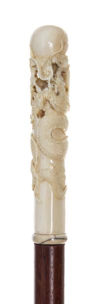 A Chinese Ivory Handled Walking Stick, Length of handle 4 1/2 x length overall 37 3/4 inches.