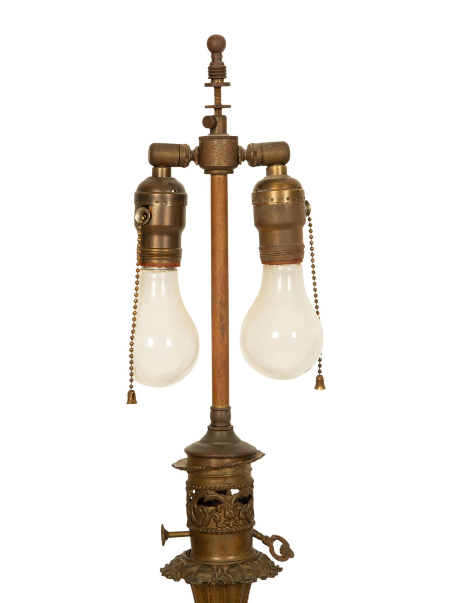 A Pair of Gilt Decorated Black Glass and Gilt Metal Oil Lamps