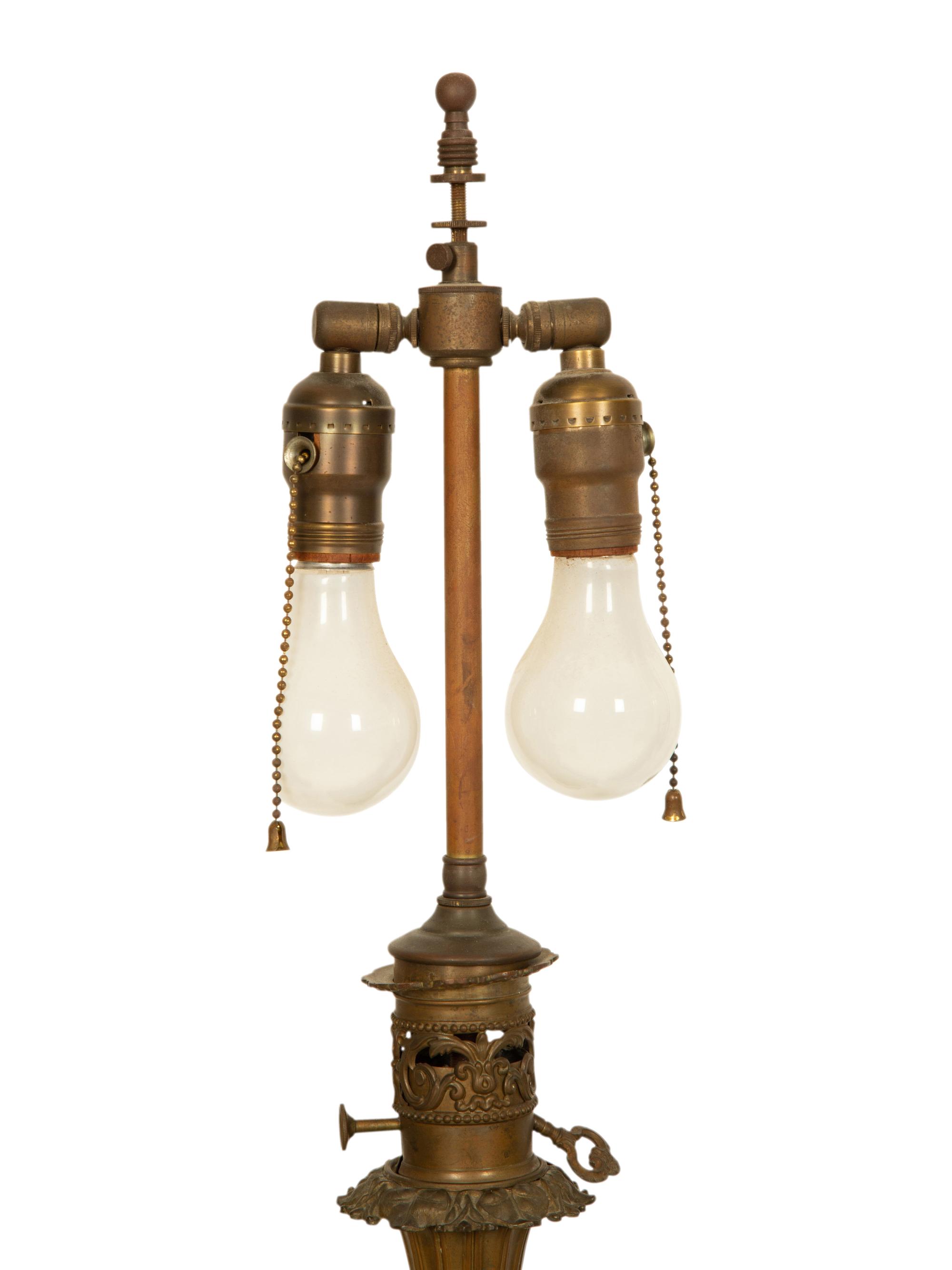 A Pair of Gilt Decorated Black Glass and Gilt Metal Oil Lamps