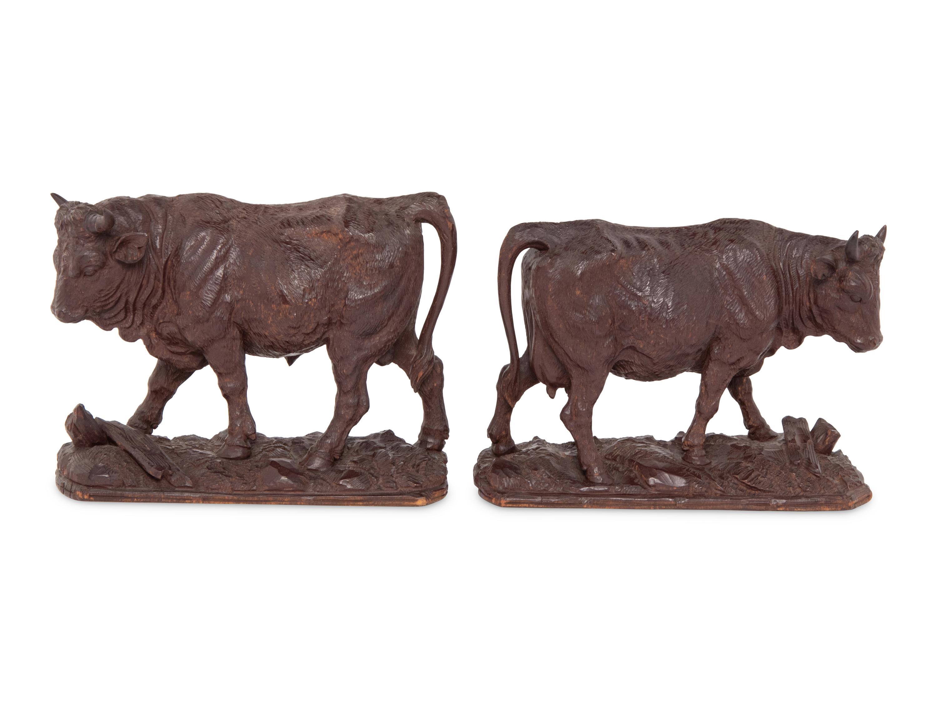 A Pair of Swiss Carved Wood Models of Cattle