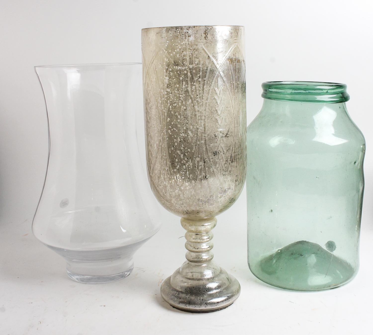 A Large Glass Candle Holder Height of first 19 3/4 inches.