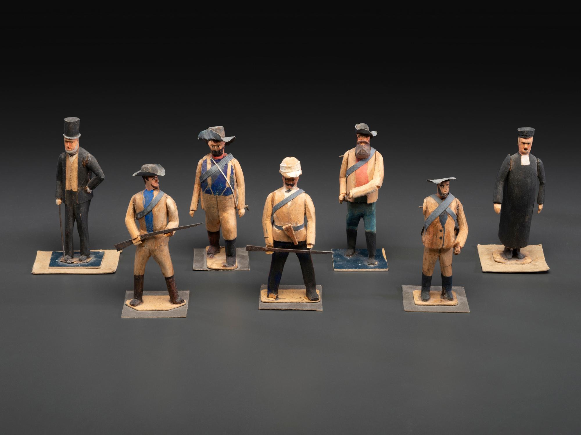 A Collection of Folk Art Carved and Painted 'English Parade' Figures