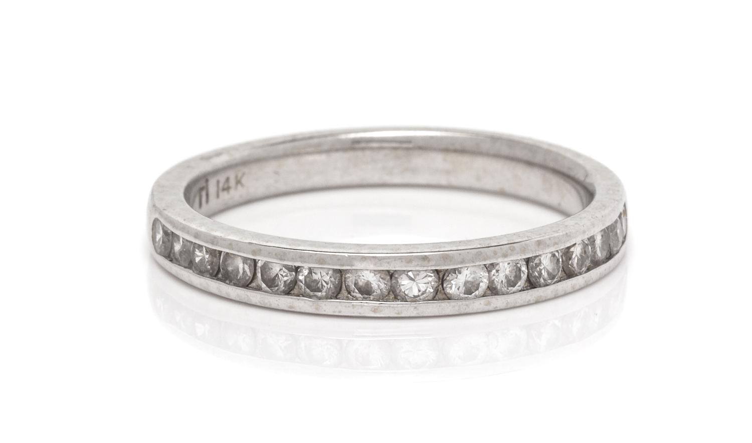A 14 Karat White Gold and Diamond Ring,