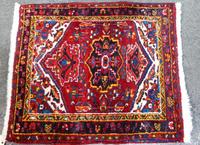 A Persian Wool Mat 2 feet 10 inches x 2 feet 6 inches. — MID 20TH CENTURY
