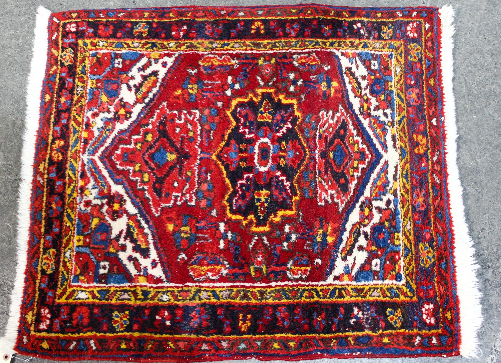 A Persian Wool Mat 2 feet 10 inches x 2 feet 6 inches. — MID 20TH CENTURY