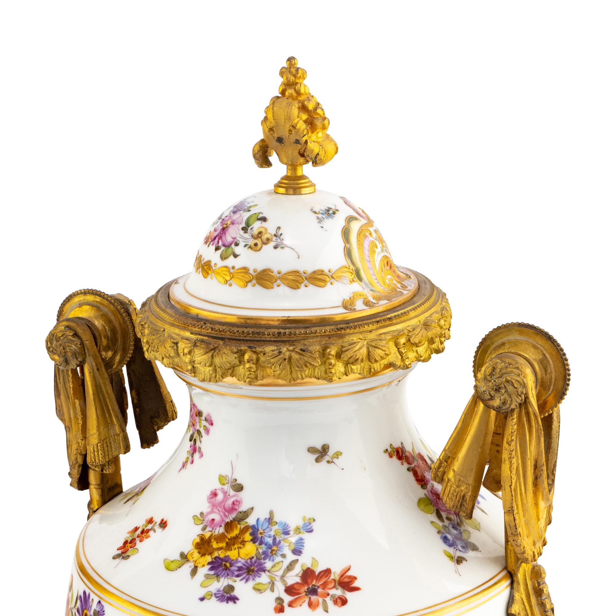 A Pair of Sèvres Style Porcelain and Gilt Bronze Mounted Urns