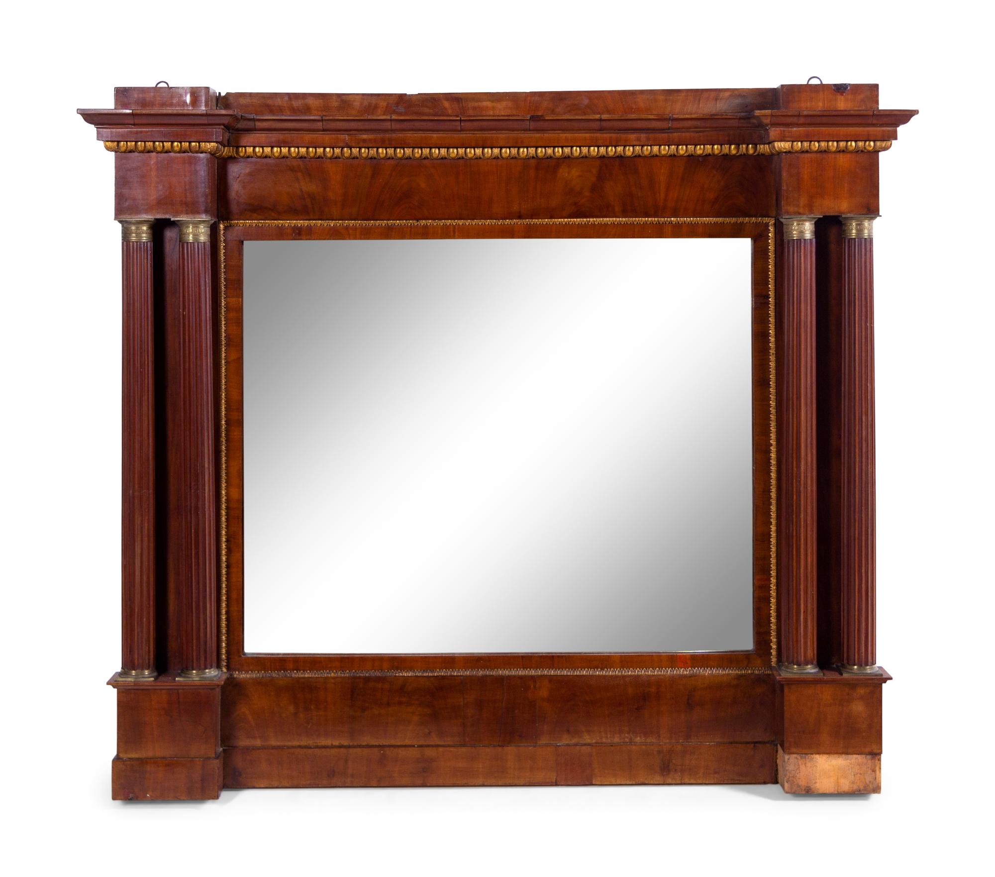 An Italian Gilt Bronze Mounted and Parcel Gilt Mahogany Overmantel Mirror