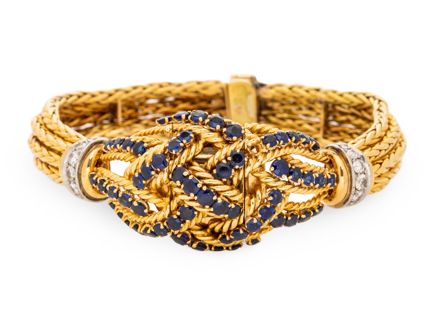 GÜBELIN, YELLOW GOLD, SAPPHIRE AND DIAMOND SURPRISE WATCH