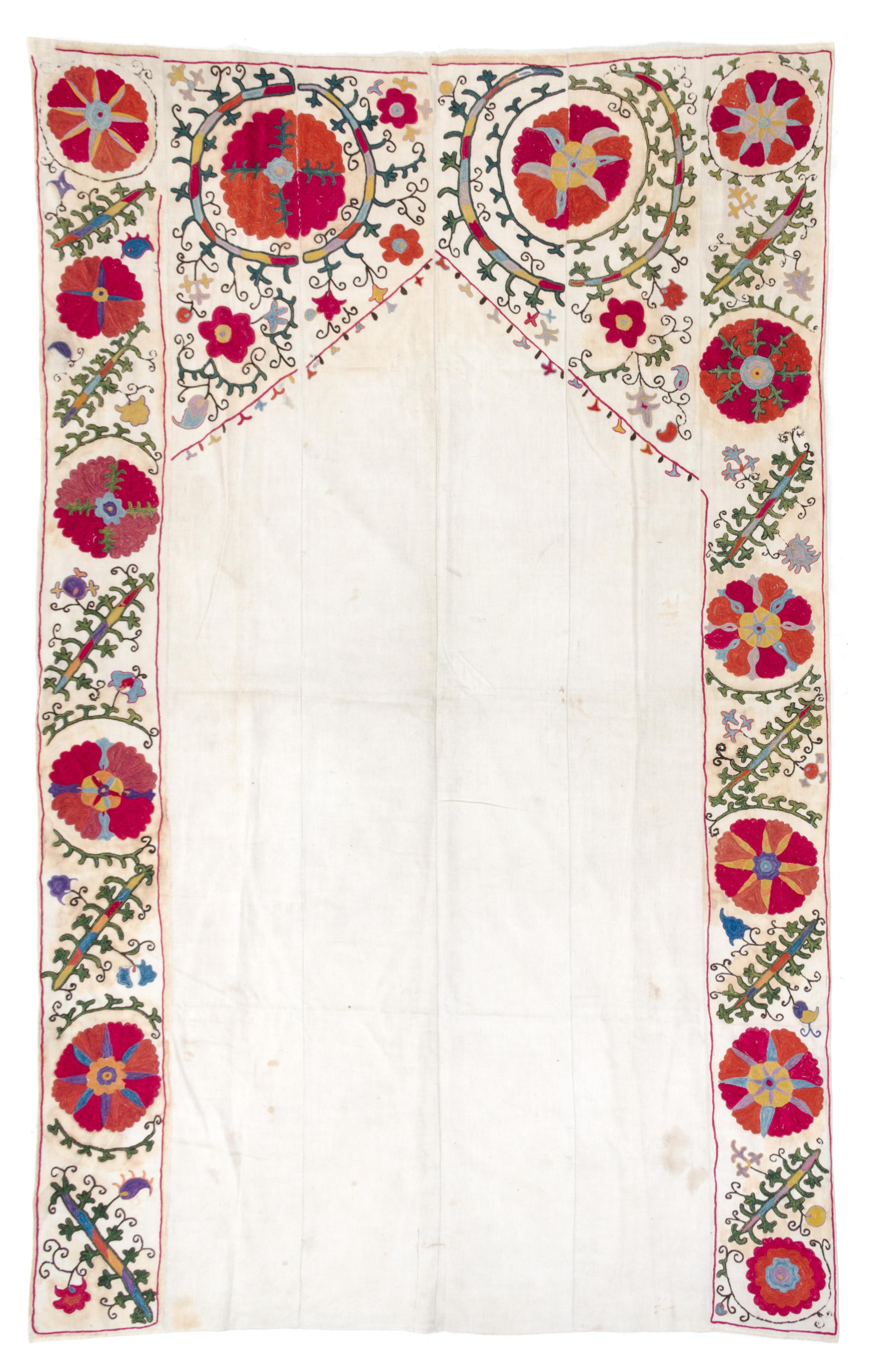 A Bokhara Prayer Arch Suzani Embroidery 7 feet 8 inches x 4 feet 9 1/4 inches. — LATE 19TH/EARLY 20TH CENTURY