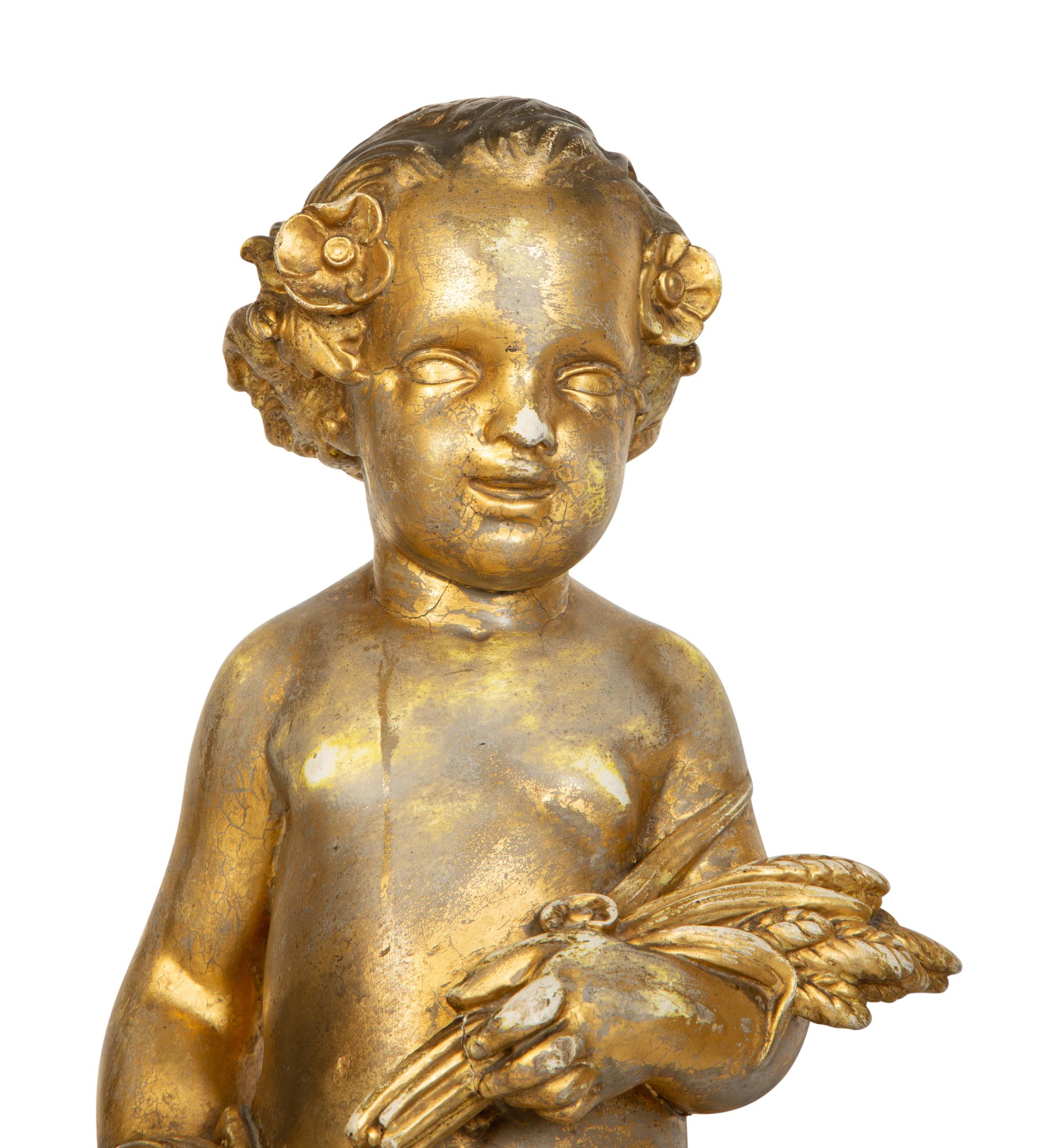 A Pair of Continental Giltwood Figures of Putti