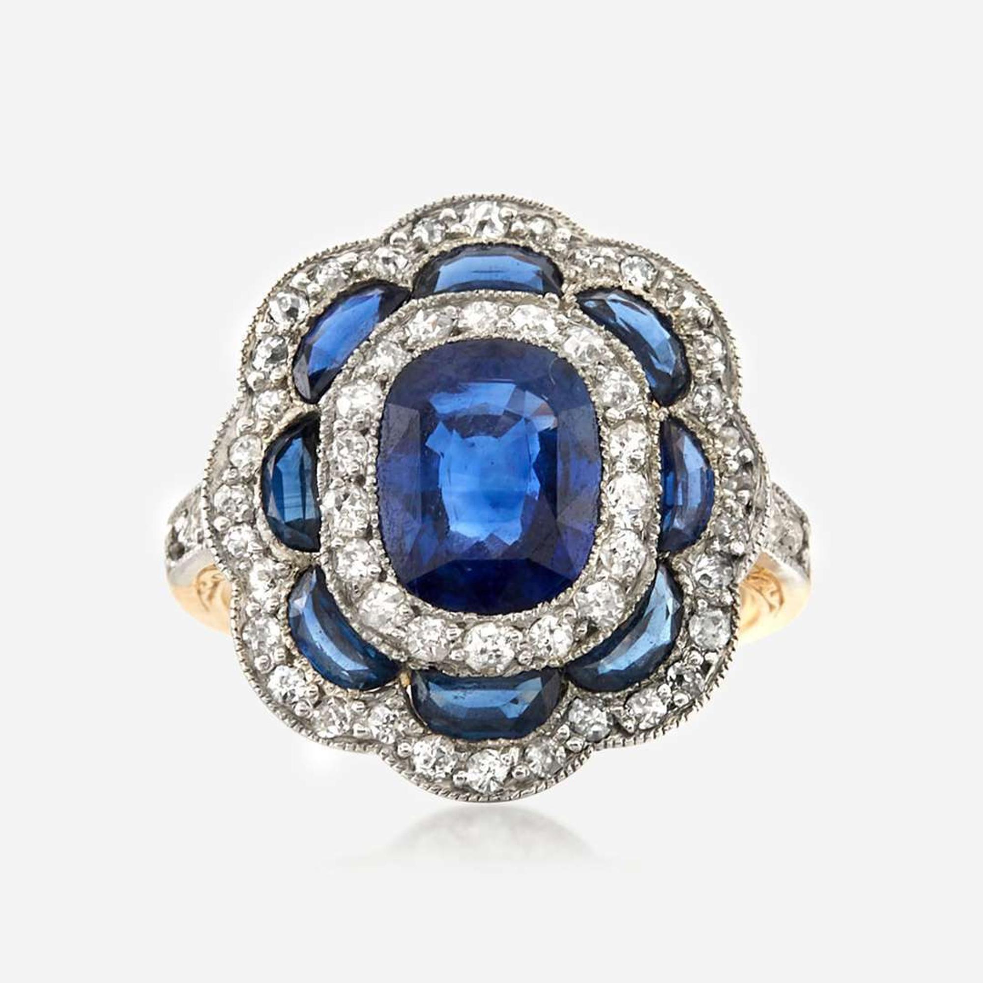 A sapphire, diamond, and platinum topped gold ring