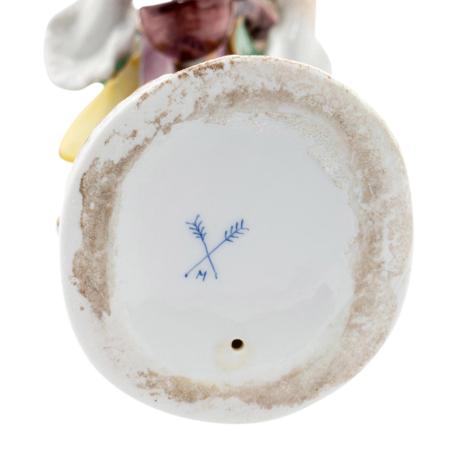 An Assembled Group of Twelve Continental Porcelain Dog Band Figures