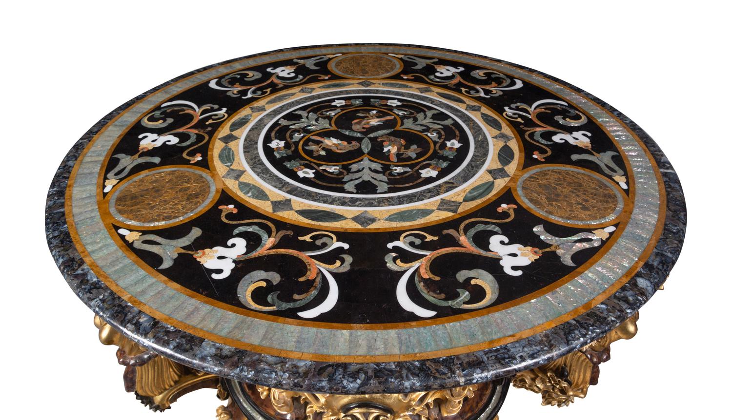 A Continental Parcel Gilt and Ebonized, Pietra Dura and Abalone Inlaid Center Table