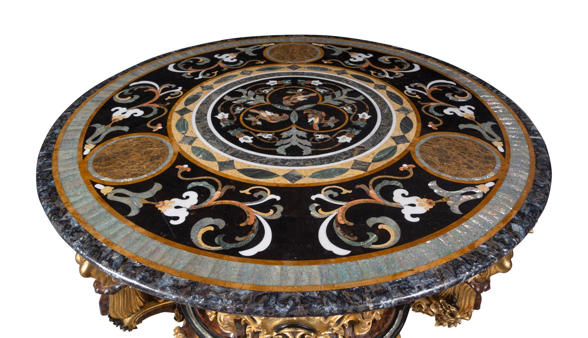 A Continental Parcel Gilt and Ebonized, Pietra Dura and Abalone Inlaid Center Table