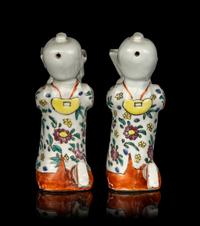 A Pair of Chinese Famille Rose Porcelain Figural-Form Candle Holders