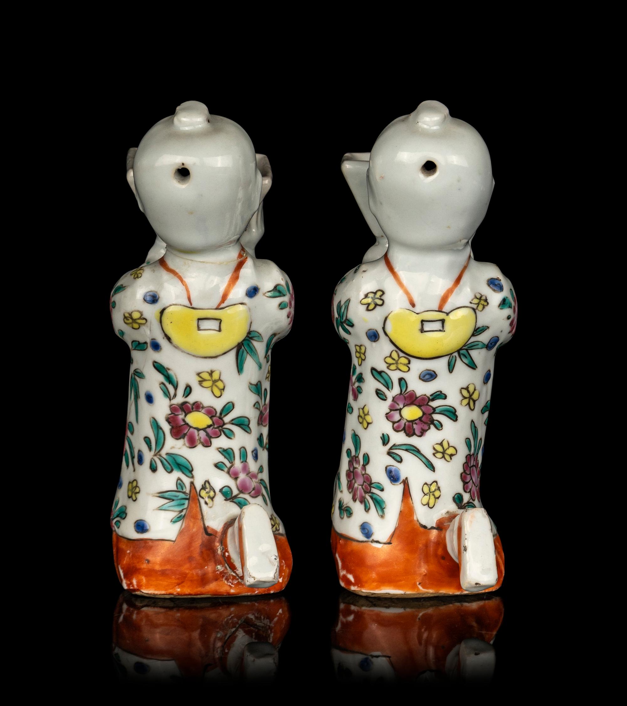 A Pair of Chinese Famille Rose Porcelain Figural-Form Candle Holders