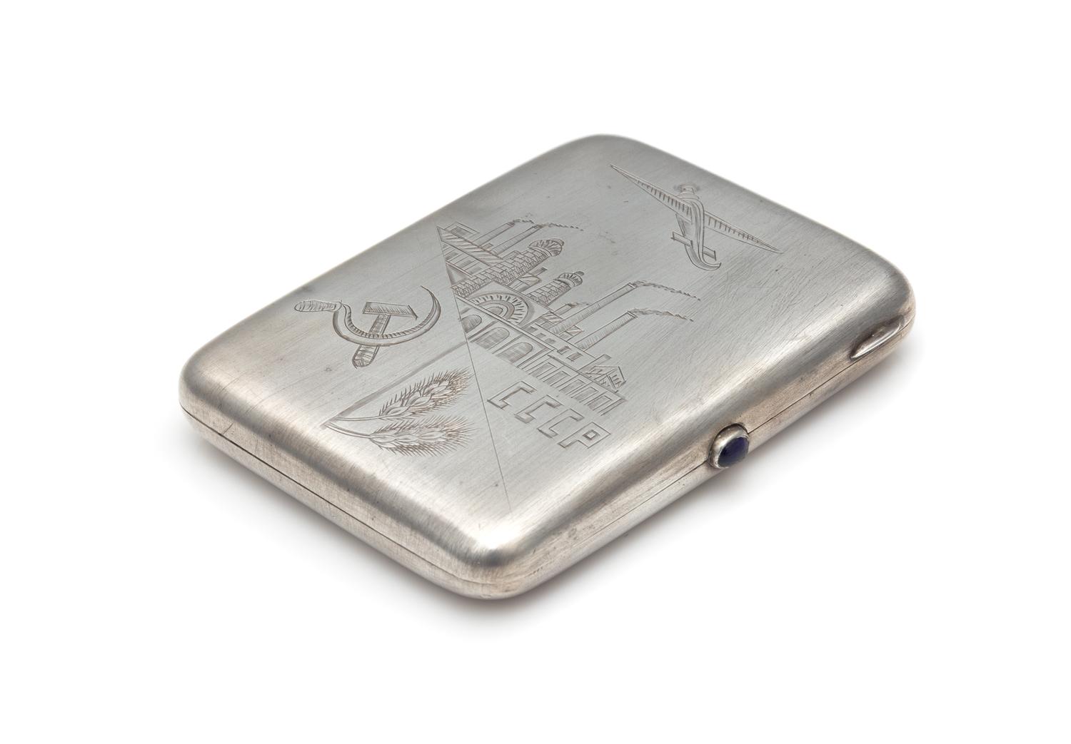 A Soviet-Era Russian Silver Cigarette Case, Maker's Mark Cyrillic 1IuF, Moscow, Early to Mid-20th Century, the lid worked to show a pro