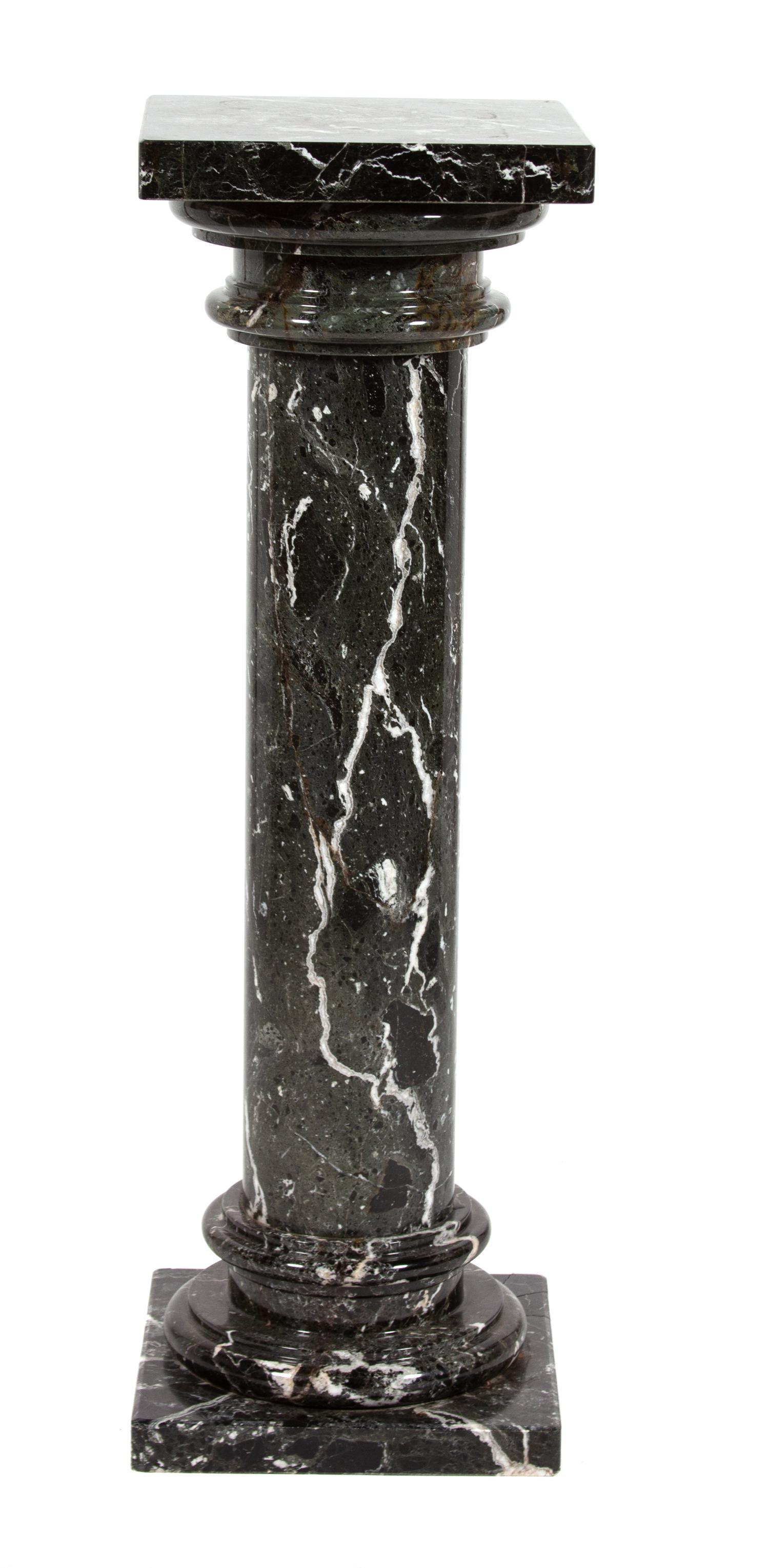 A Black and White Variegated Marble Pedestal