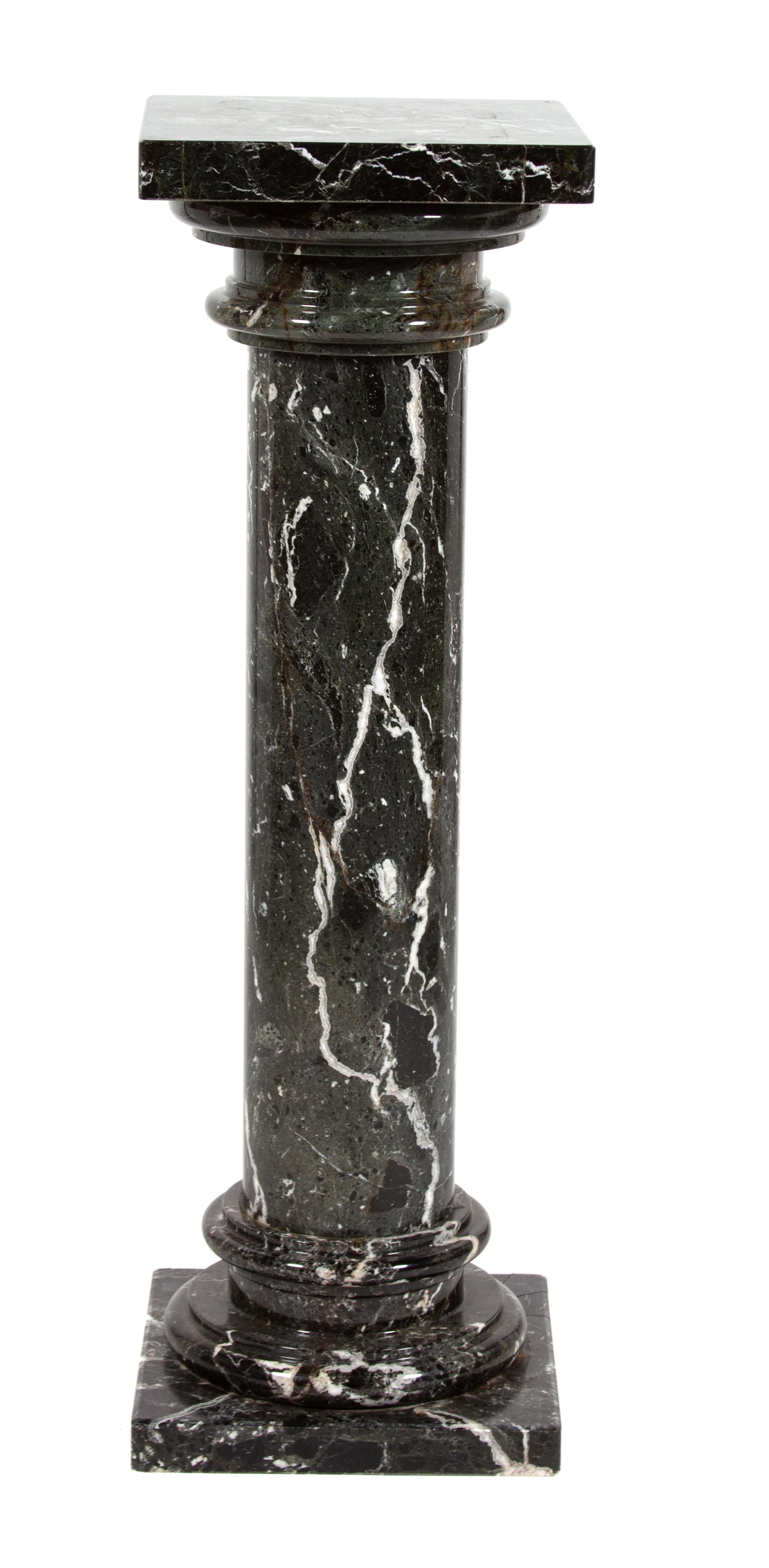 A Black and White Variegated Marble Pedestal